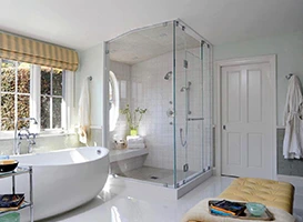 Golden retriever puppy sits in a field of yellow flowers.