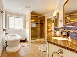 Renovated bathroom with tub, shower, and vanity.