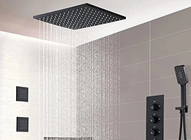 Modern bathroom with large square rainfall shower head and gray tile.