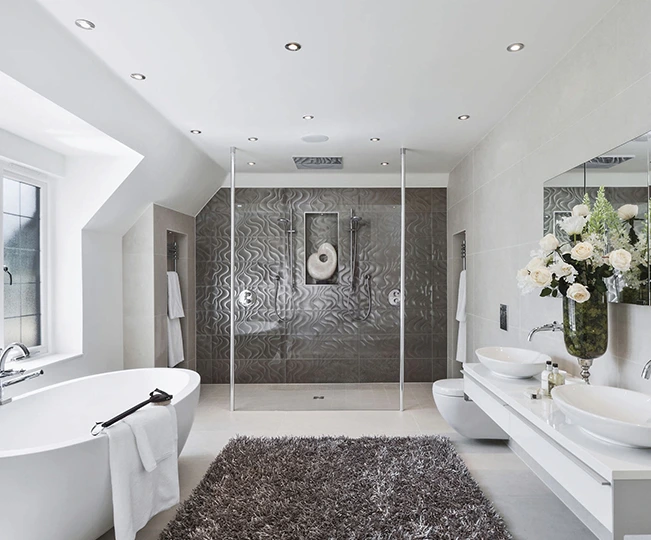 Modern bathroom with dual sinks, a freestanding tub, and a walk-in shower.