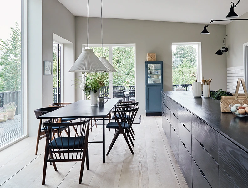 modern kitchen with dining table, blue cabinet, and large windows. Kitchen Remodeling