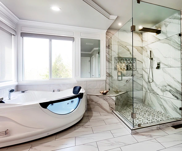 Luxurious bathroom with a modern jacuzzi tub and marble shower.
