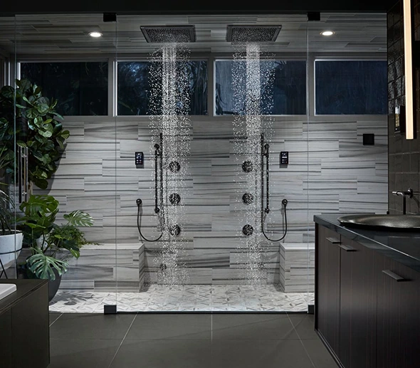 Luxury dual shower with rain shower heads and body jets.
