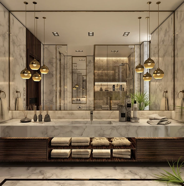Luxury bathroom with marble countertops, wooden cabinets, and gold pendant lights.