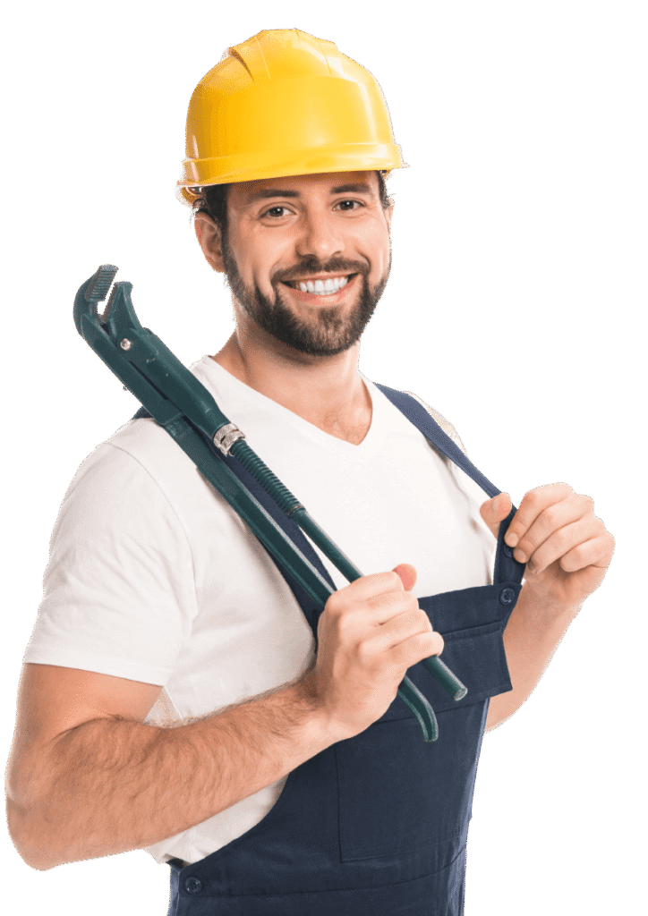 Smiling plumber in hard hat holding pipe wrench.